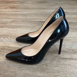 Stuart Weitzman black pumps .